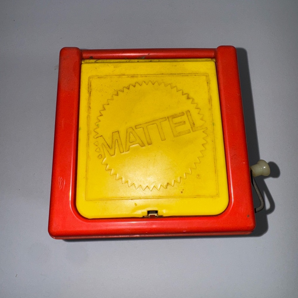 Mattel Red and Yellow Crank Toy